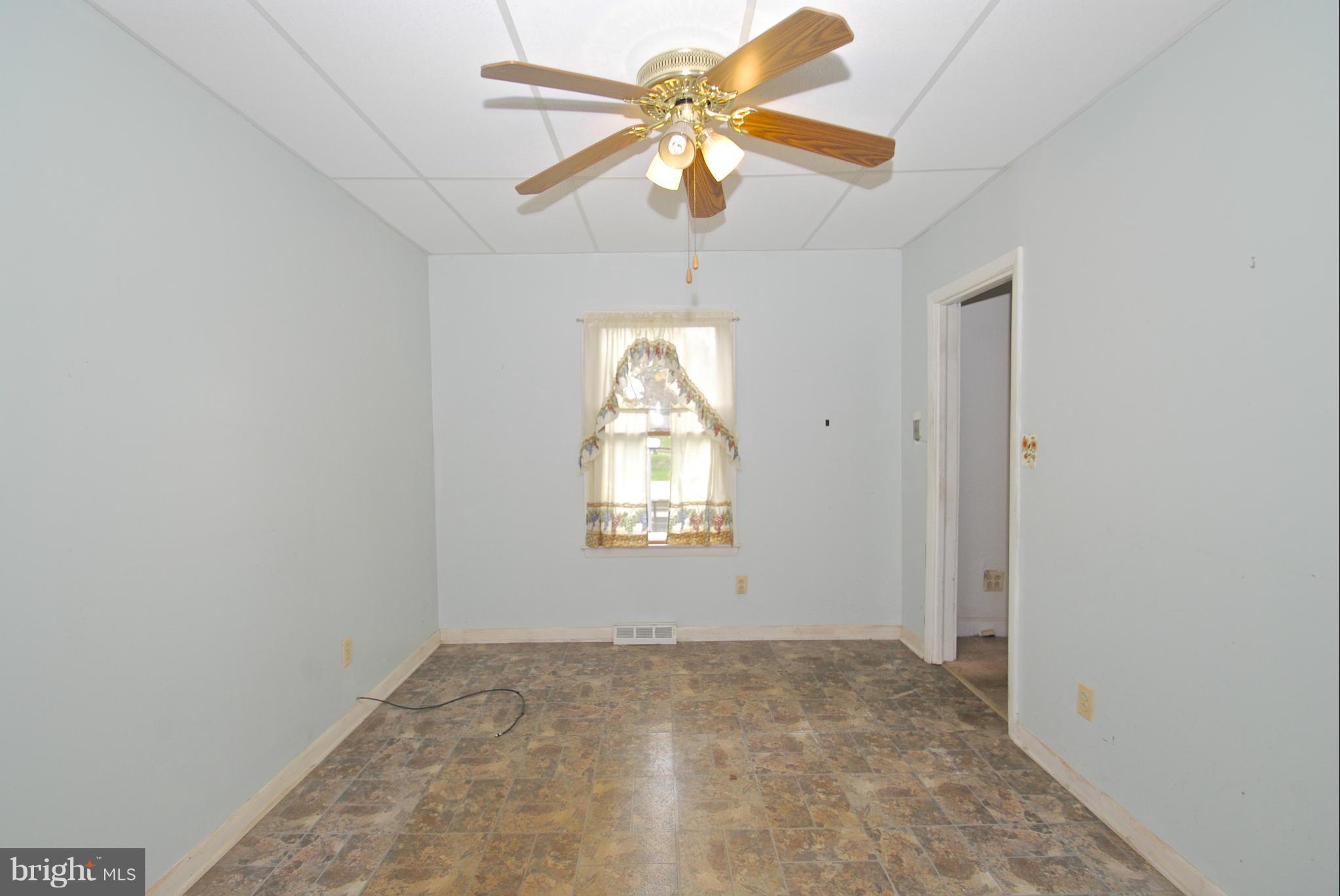 717 Red Cedar Road Annapolis, MD 21409 - Photo 8 of 30 an empty room with windows and fan