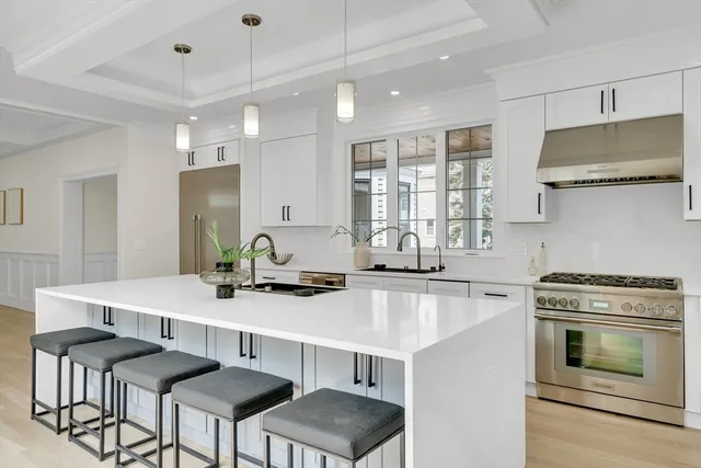 a kitchen that has a table and chairs in it