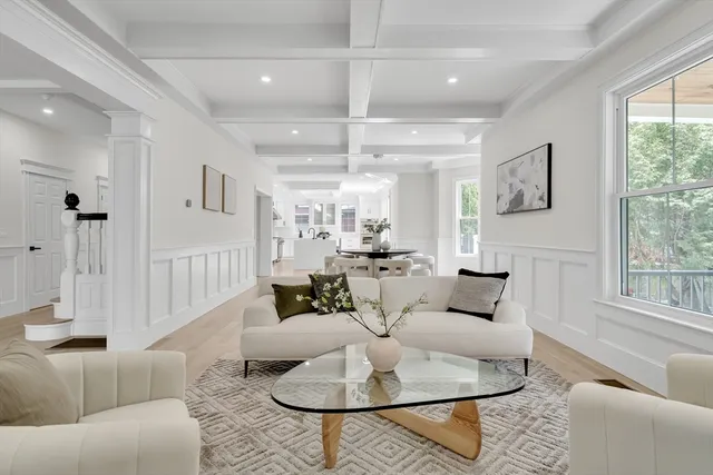 a living room with furniture or couches and a large window