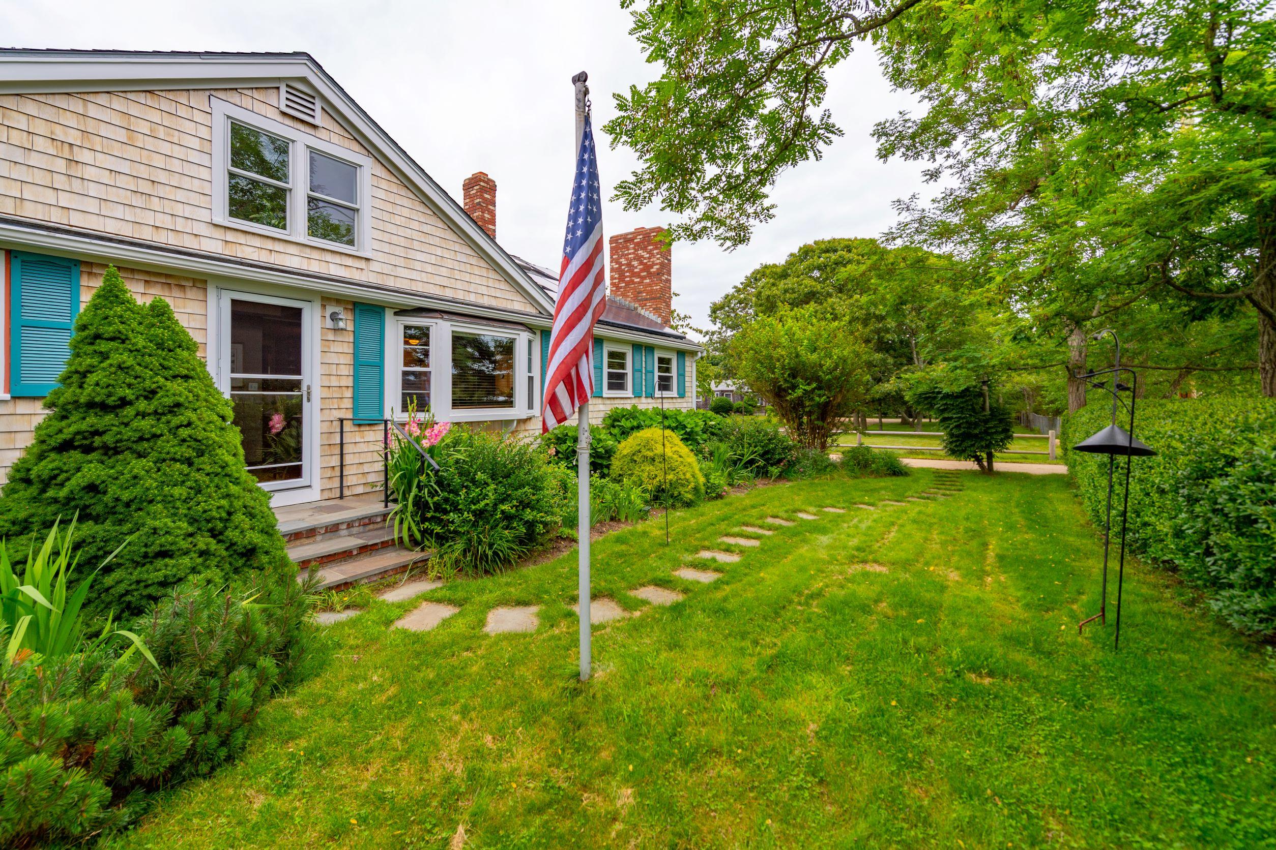 249 West Tisbury Road Edgartown, MA 02539 - Photo 17 of 24 a front view of house with yard and green space