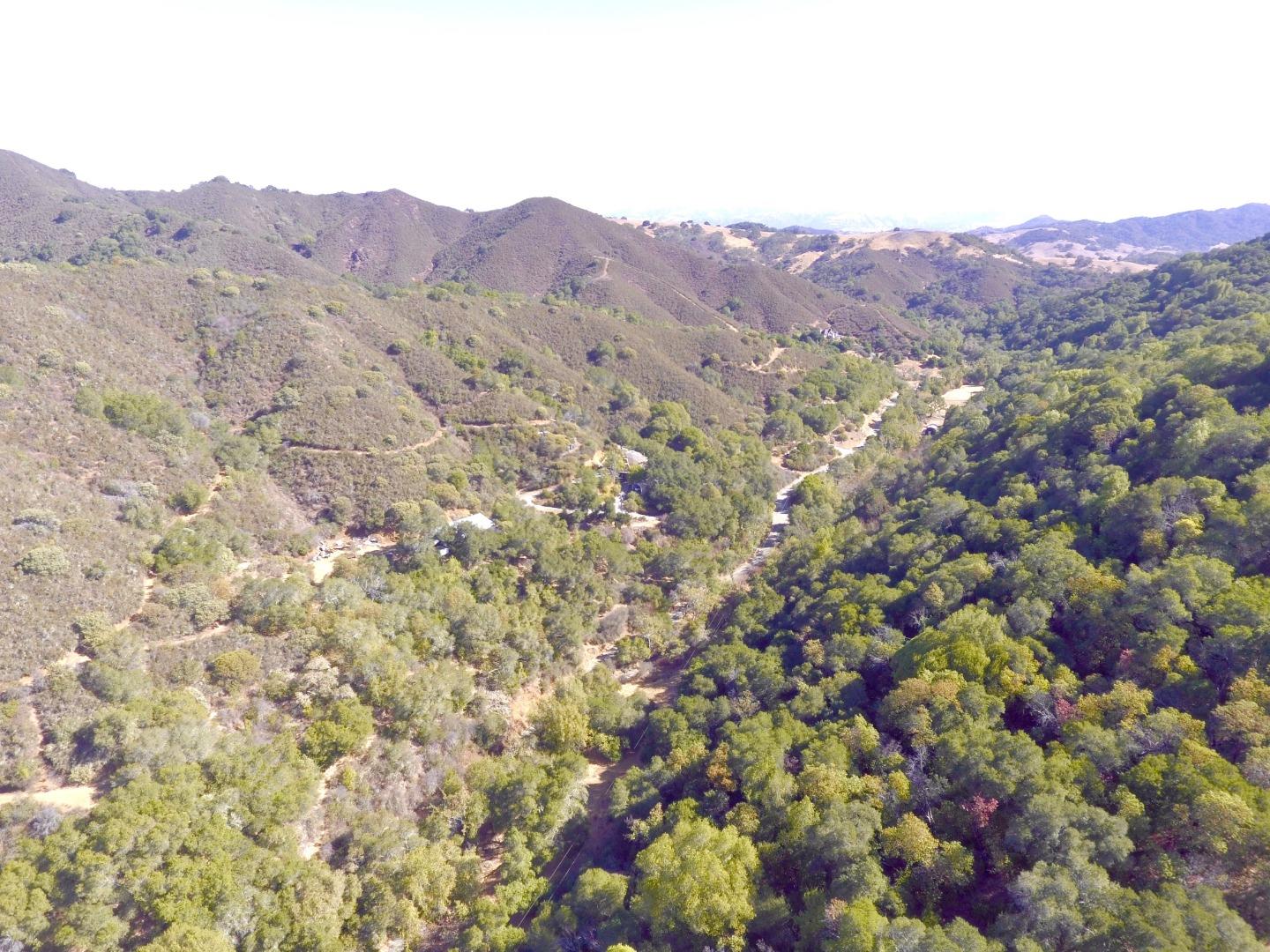 6379 Little Uvas Road Morgan Hill, CA 95037 - Photo 5 of 6 a view of a lush green hillside and a houses