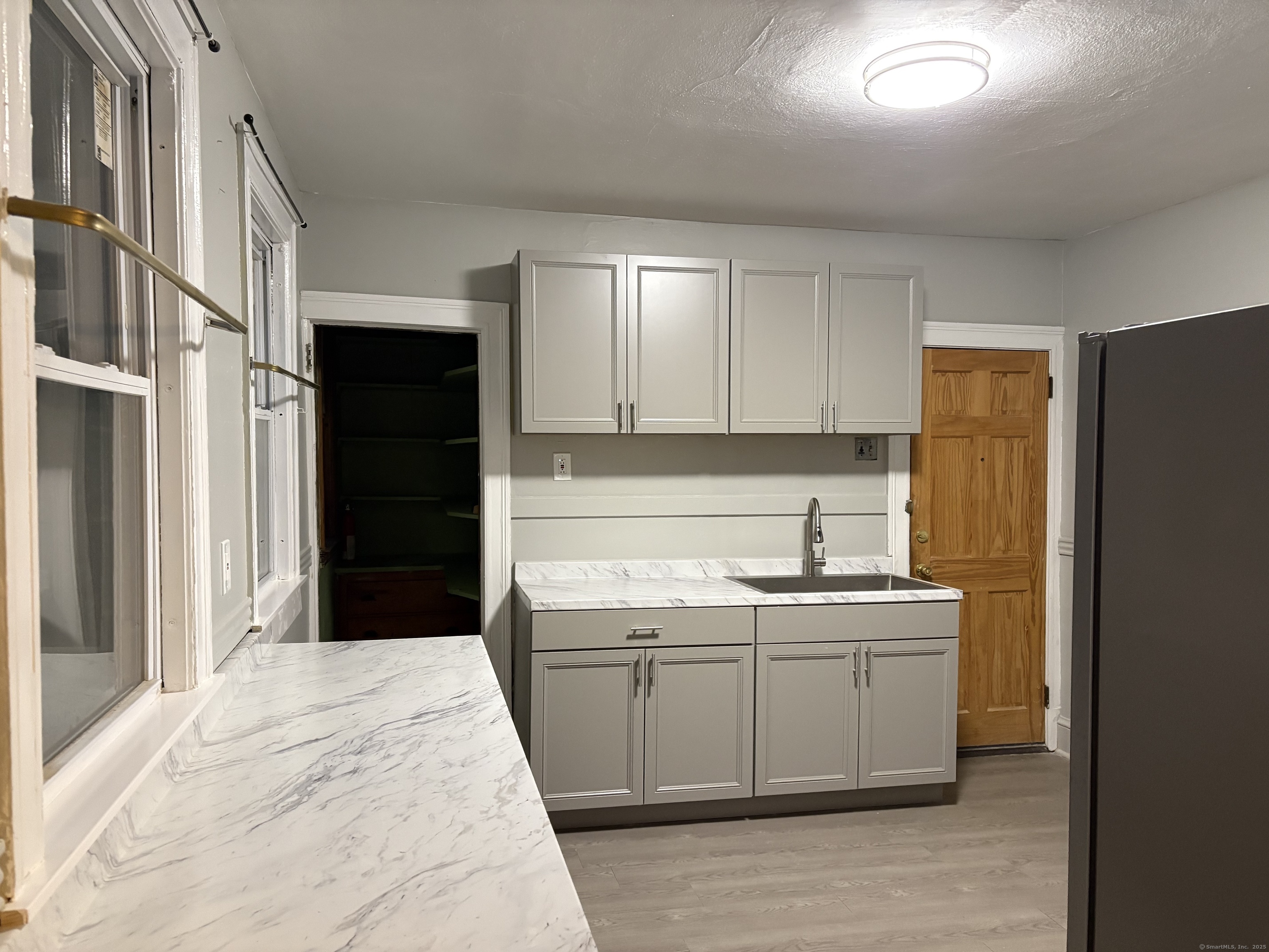 Undisclosed Address Hartford, CT 06112 - Photo 2 of 7 a kitchen with a sink and cabinets