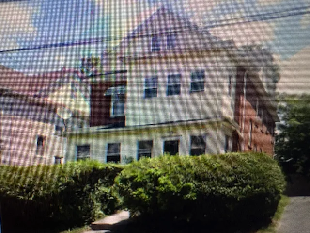 a view of a house with a garden