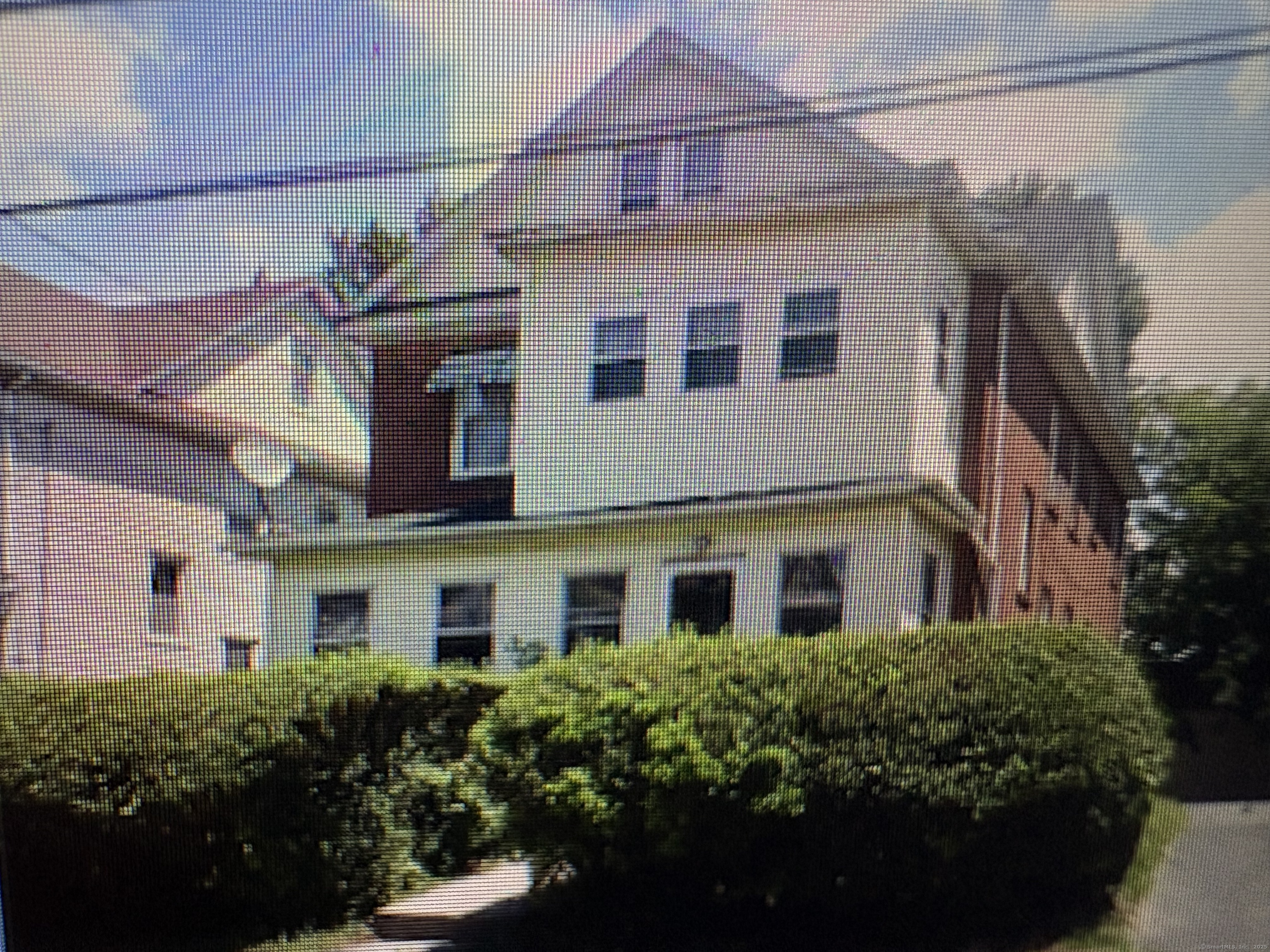 Undisclosed Address Hartford, CT 06112 - Photo 7 of 7 a view of a house with a garden