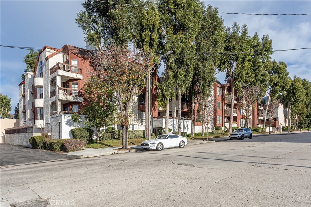 230 Bethany Road, Unit 306 Burbank, CA 91504 - Photo 1 of 44 front view of a building with a street