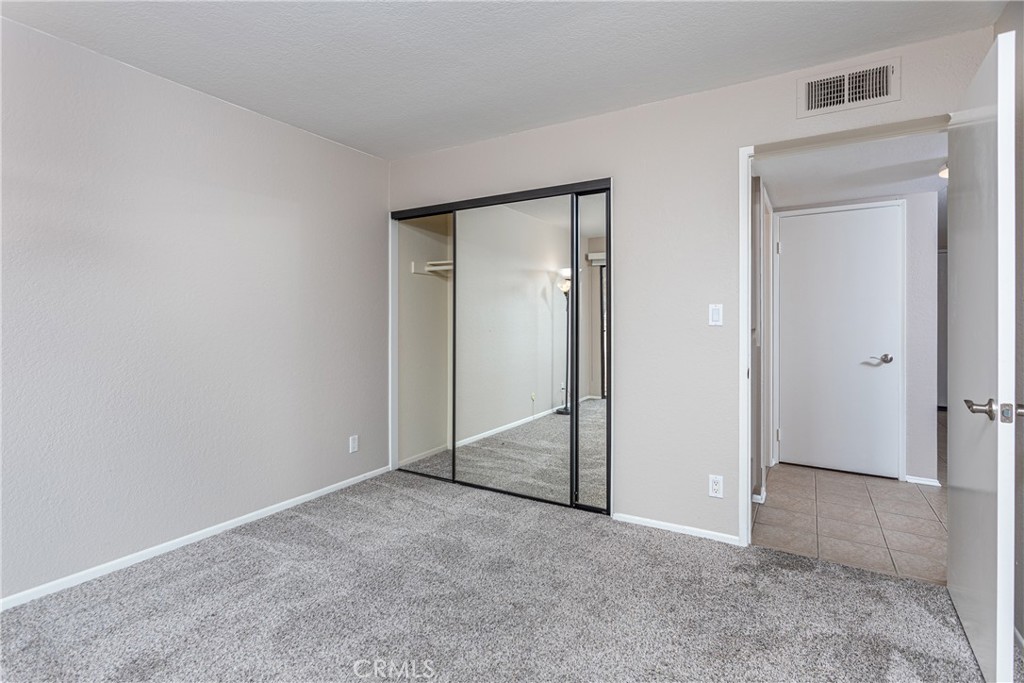 230 Bethany Road, Unit 306 Burbank, CA 91504 - Photo 31 of 44 an empty room with closet and a bathroom