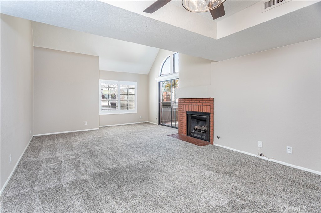 230 Bethany Road, Unit 306 Burbank, CA 91504 - Photo 7 of 44 a view of a livingroom with a fireplace and window