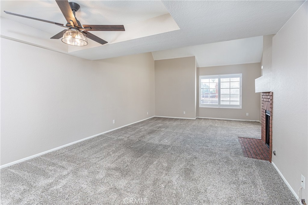 230 Bethany Road, Unit 306 Burbank, CA 91504 - Photo 8 of 44 an empty room with windows and fan