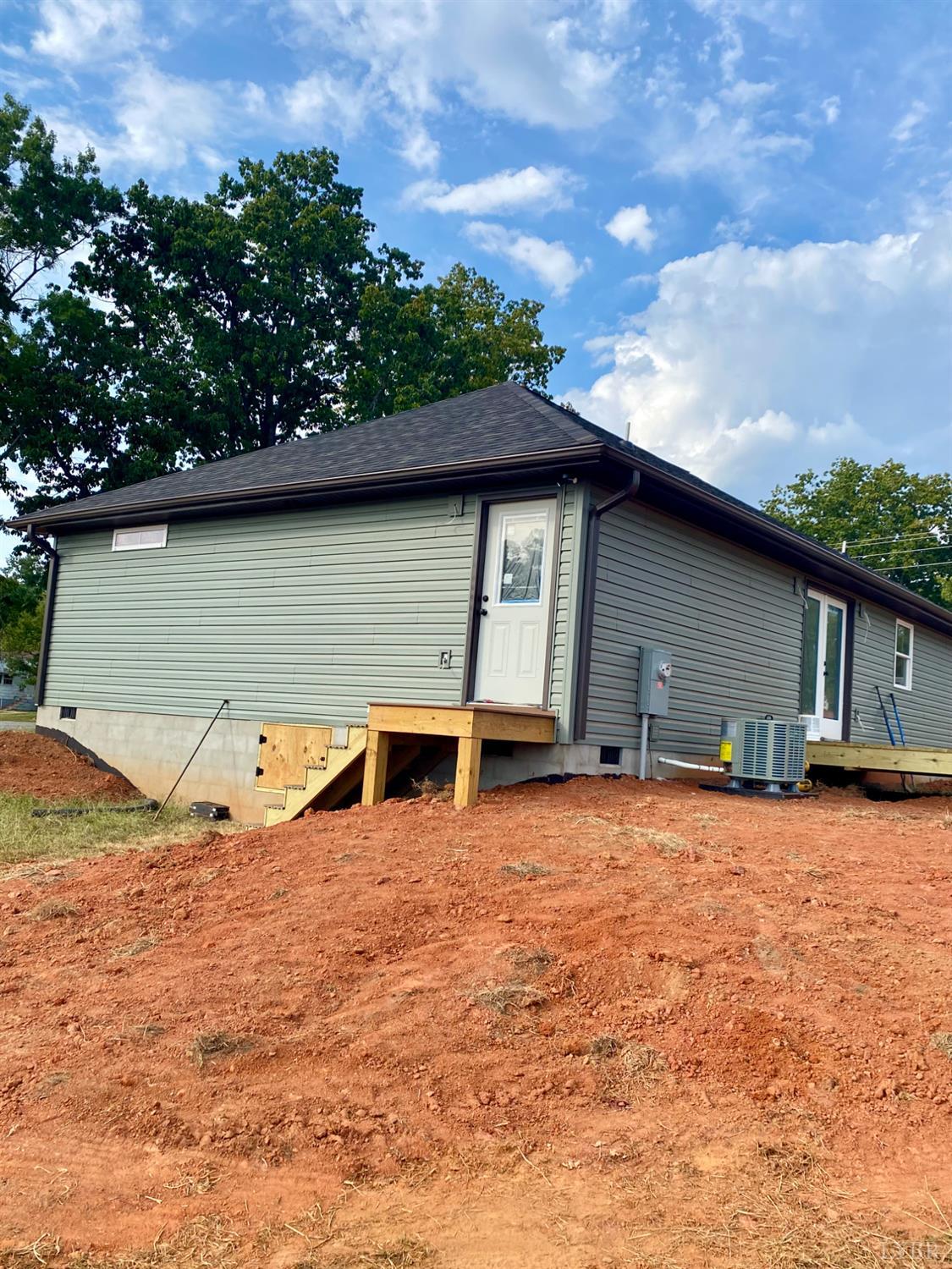 1078 Quaker Church Road Bedford, VA 24523 - Photo 4 of 20 a backyard of a house with wooden floor and barbeque oven
