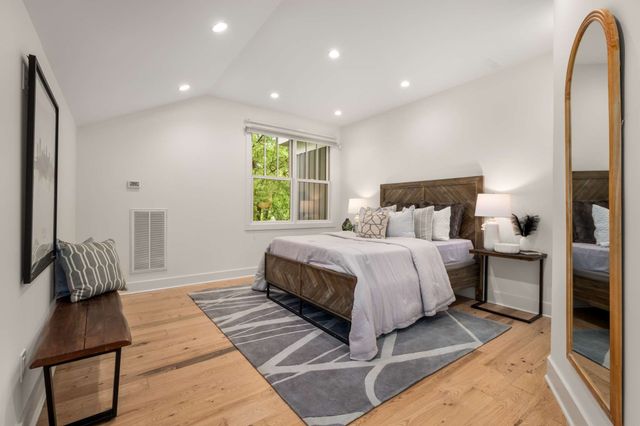 a bathroom with a double vanity sink toilet and shower