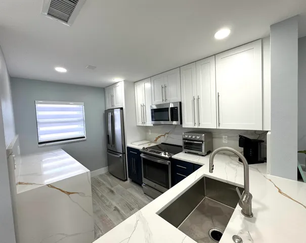 a bedroom with a bed and a night stand