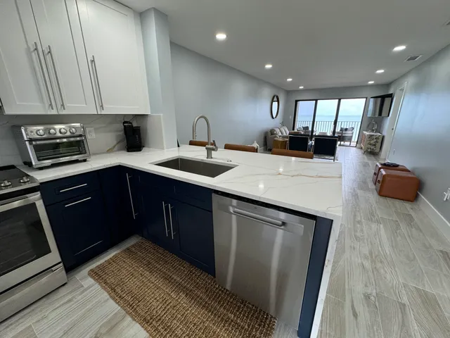 a bedroom with a bed and painting on the wall