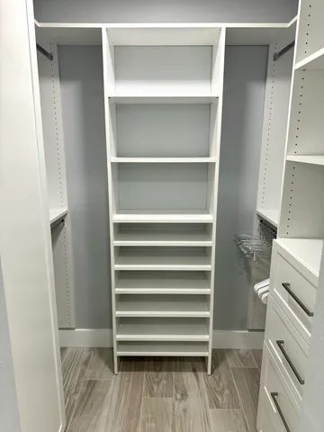 a bathroom with a sink mirror vanity and toilet