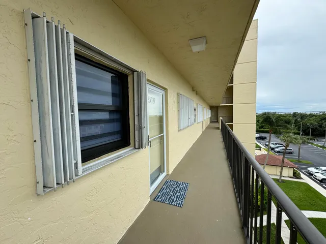 a dining room with furniture and a wooden floor