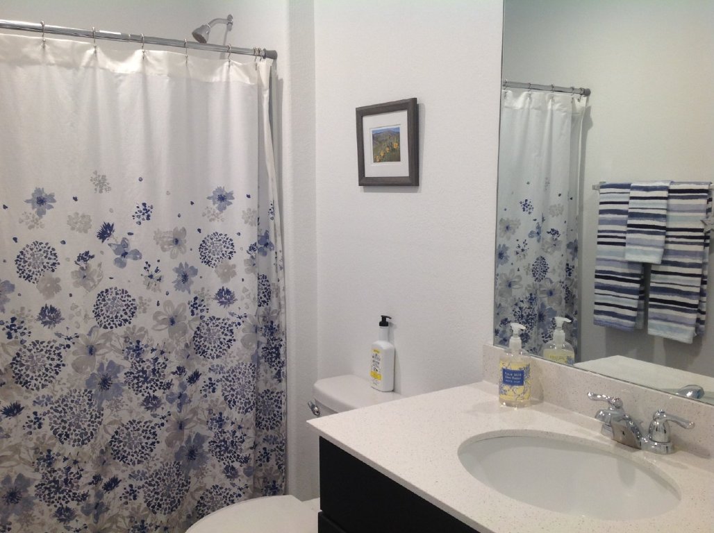 13801 Mussel Run Elgin, TX 78621 - Photo 12 of 18 a bathroom with a sink and a mirror