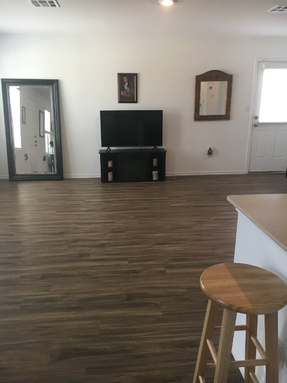 13801 Mussel Run Elgin, TX 78621 - Photo 2 of 18 a view of a room with furniture and wooden floor