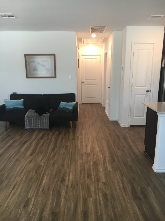 13801 Mussel Run Elgin, TX 78621 - Photo 4 of 18 a view of a livingroom with furniture and wooden floor