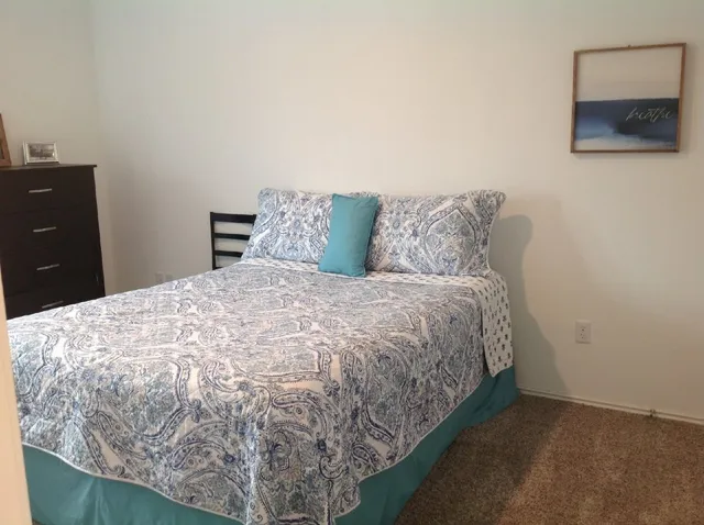 a kitchen with stainless steel appliances wooden cabinets and a refrigerator