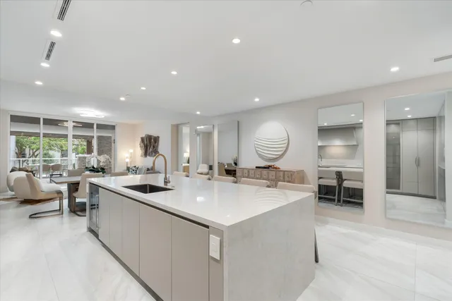 a large kitchen with a table and chairs