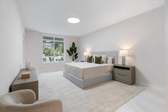 a bedroom with a bed and a cabinets