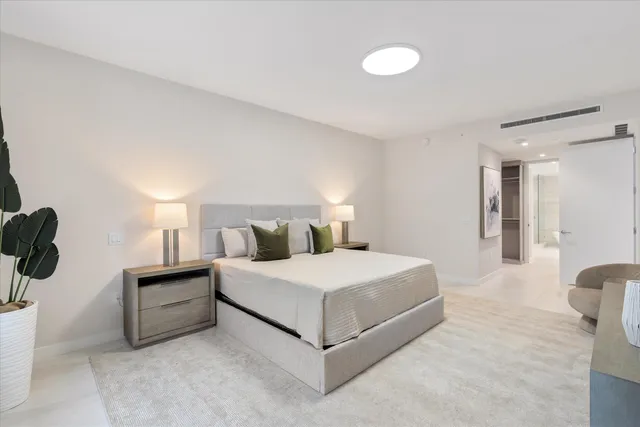 a bedroom with a bed and with furniture