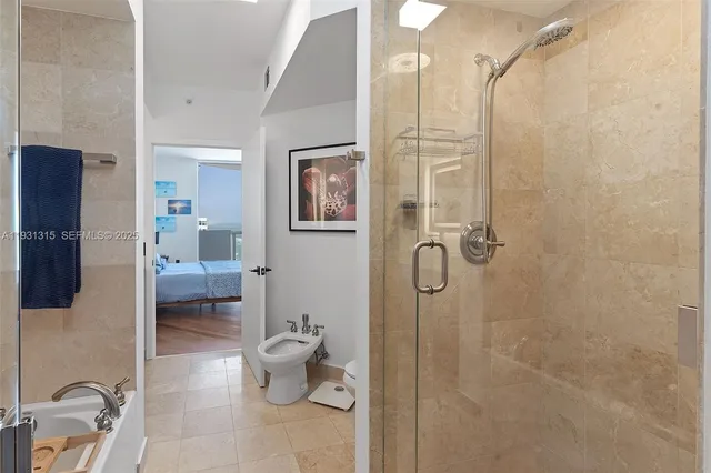 a bathroom with a granite countertop shower a toilet and sink