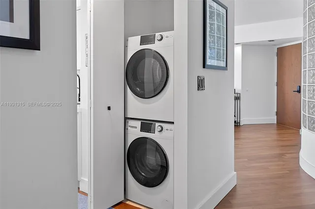 a view of a hallway with washer and dryer