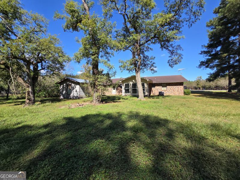 7307 Blocker Road Glennville, GA 30427 - Photo 6 of 6 a view of a house with a yard