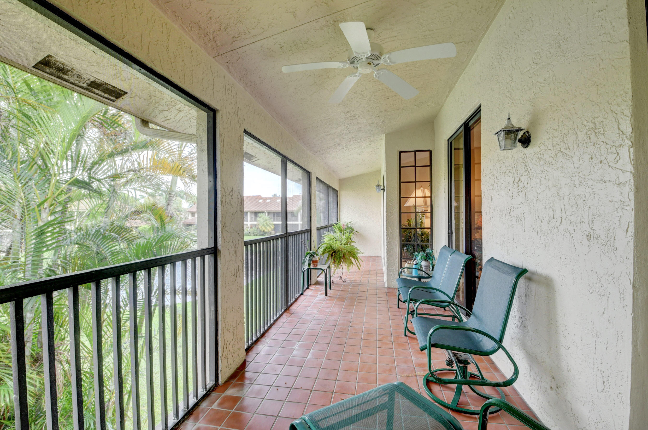 7861 La Mirada Drive Boca Raton, FL 33433 - Photo 13 of 26 a view of a porch with furniture and a yard