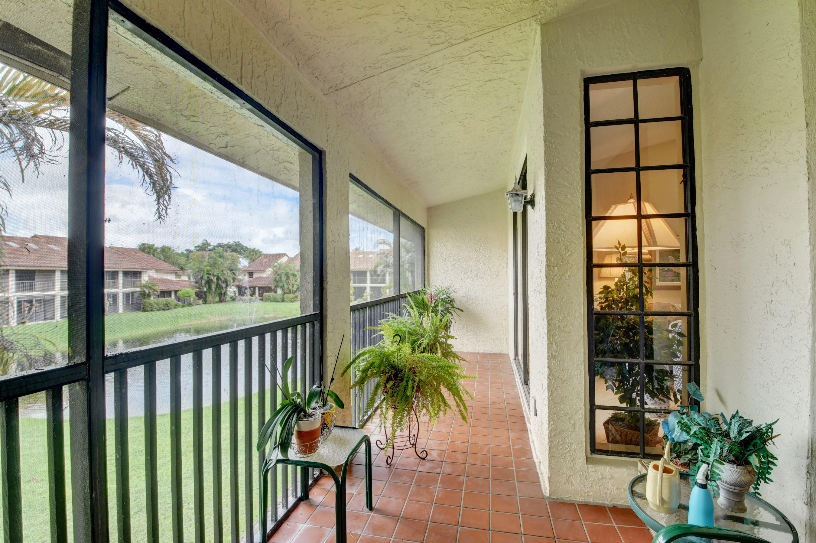 7861 La Mirada Drive Boca Raton, FL 33433 - Photo 14 of 26 a room with balcony and wooden floor
