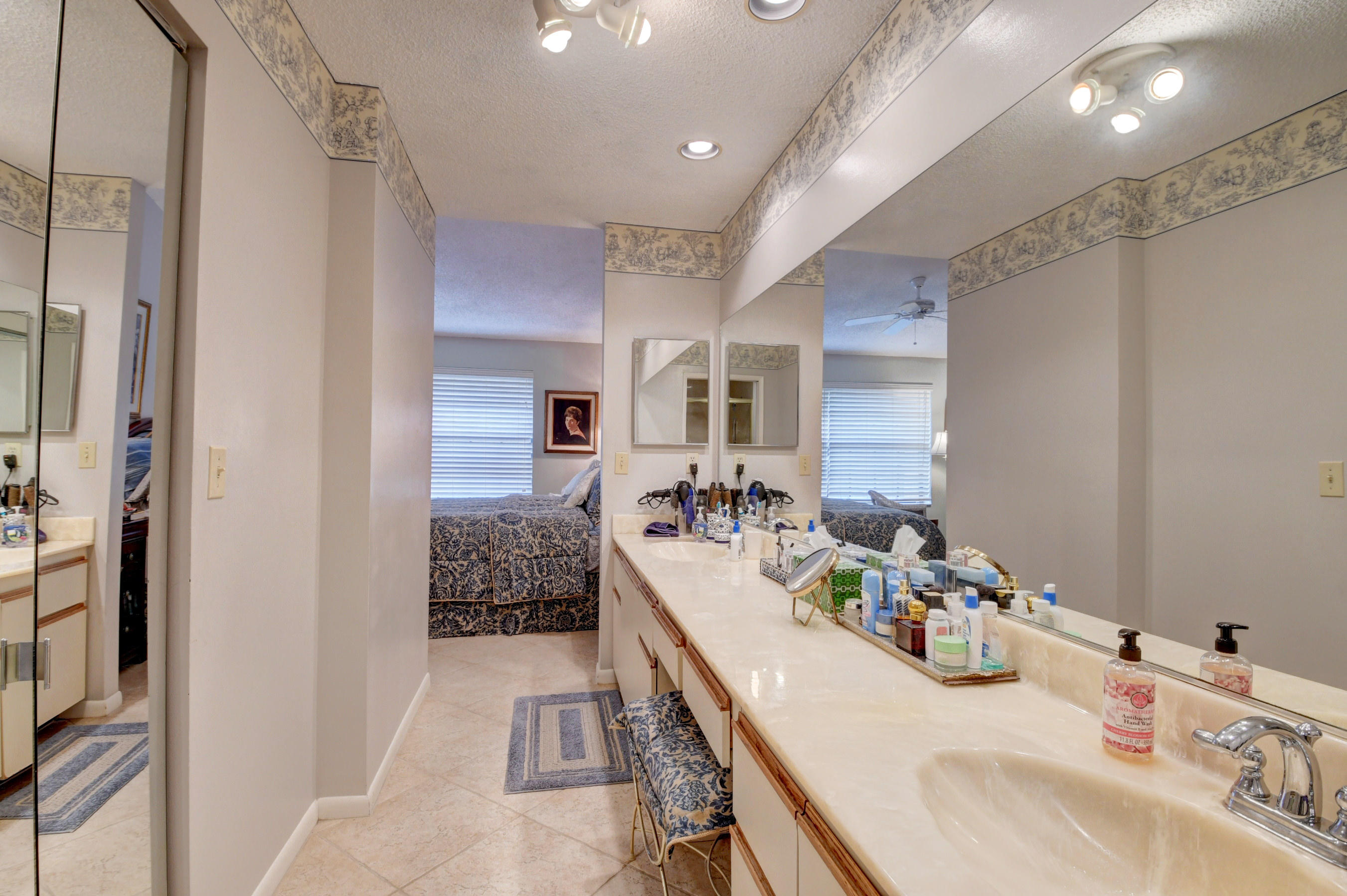 7861 La Mirada Drive Boca Raton, FL 33433 - Photo 21 of 26 a bathroom with a double vanity sink mirror and shower