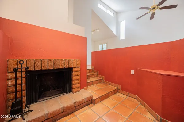 a view of a living room with a fireplace