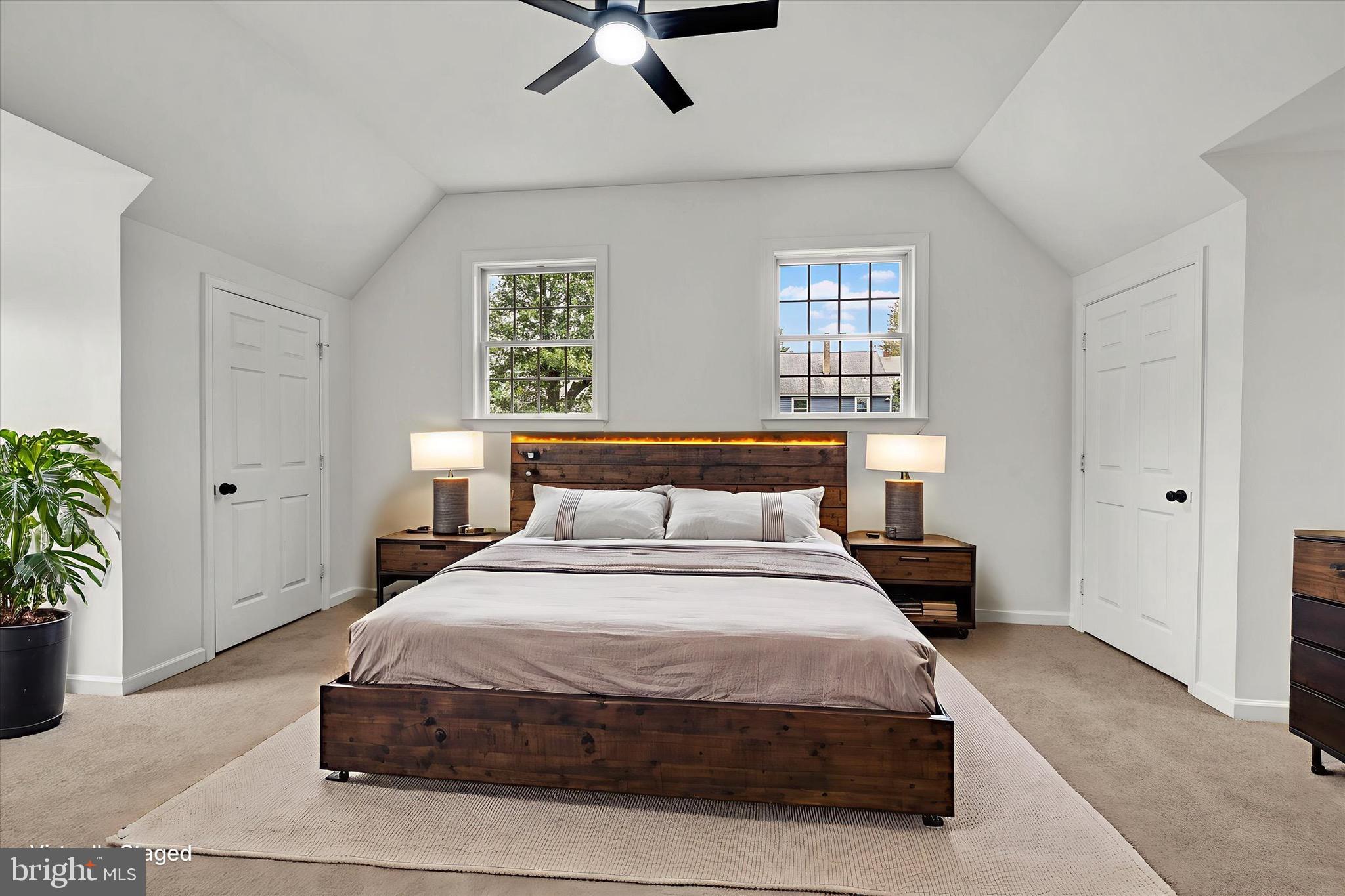 2108 Sunbriar Road Baltimore, MD 21207 - Photo 17 of 50 a bedroom with a bed and potted plant