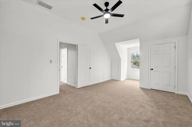 a view of a big room with carpet