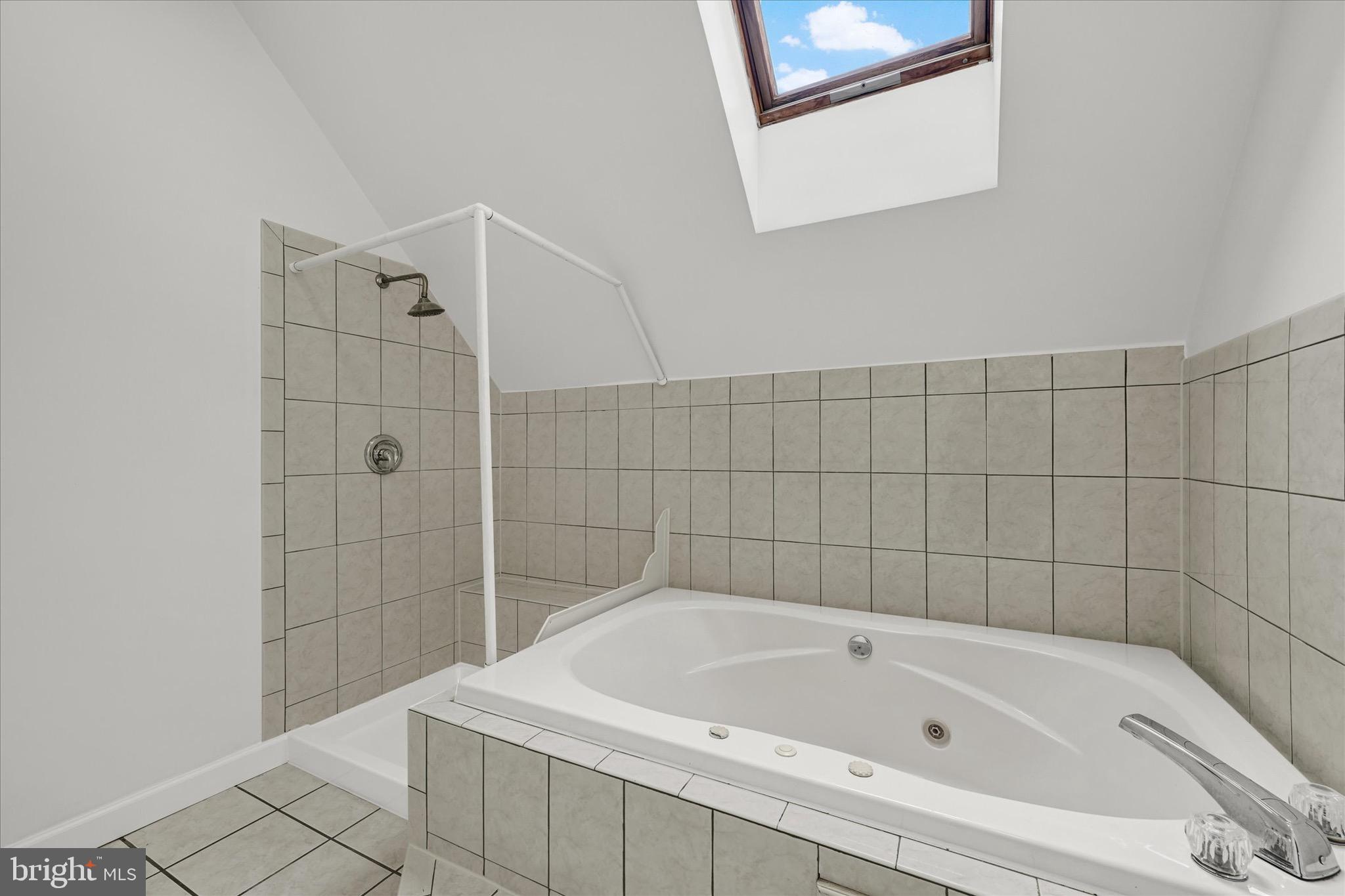 2108 Sunbriar Road Baltimore, MD 21207 - Photo 20 of 50 a bathroom with a bathtub and shower