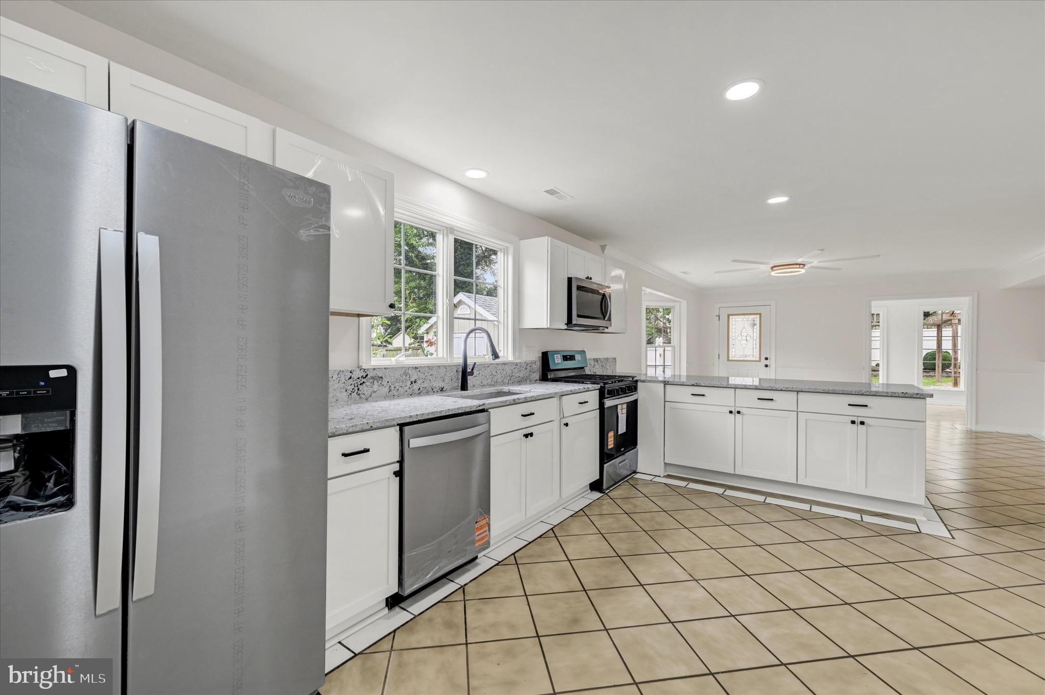 2108 Sunbriar Road Baltimore, MD 21207 - Photo 2 of 50 a kitchen with granite countertop cabinets and stainless steel appliances