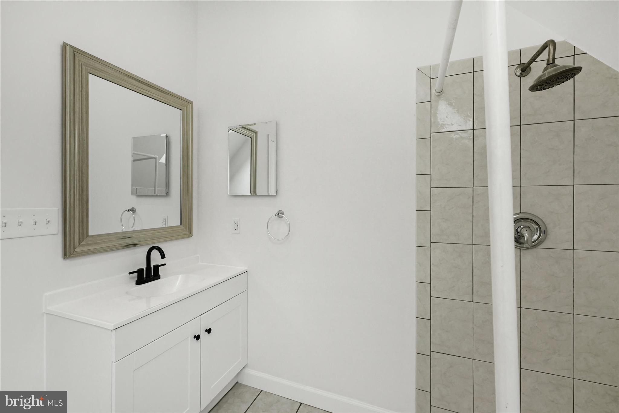 2108 Sunbriar Road Baltimore, MD 21207 - Photo 21 of 50 a bathroom with a sink and mirror