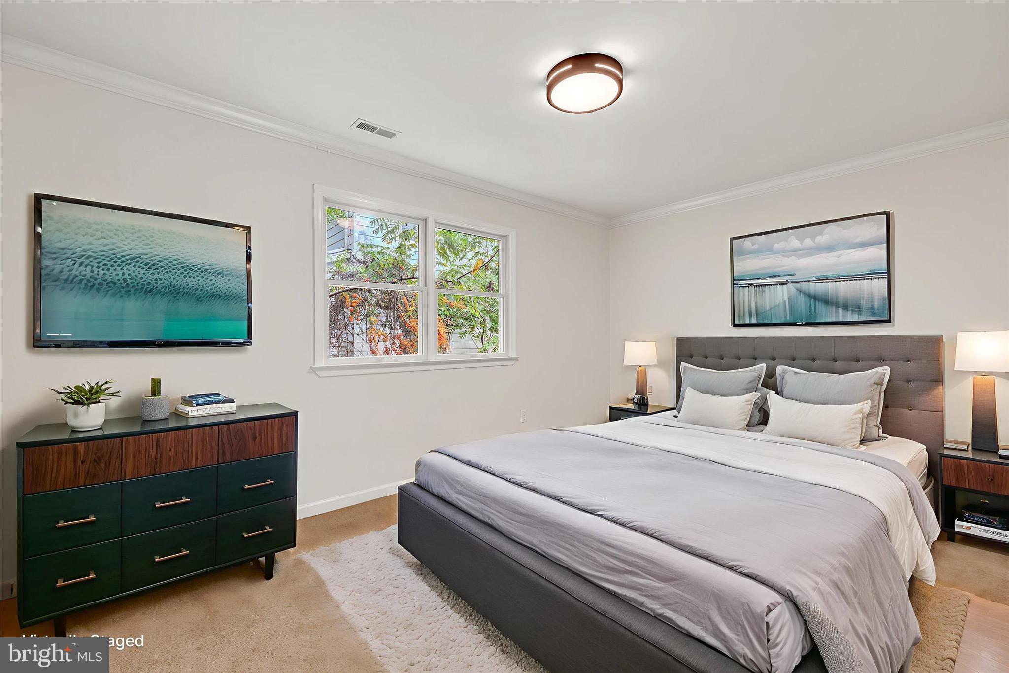 2108 Sunbriar Road Baltimore, MD 21207 - Photo 25 of 50 a bedroom with a bed and a flat screen tv