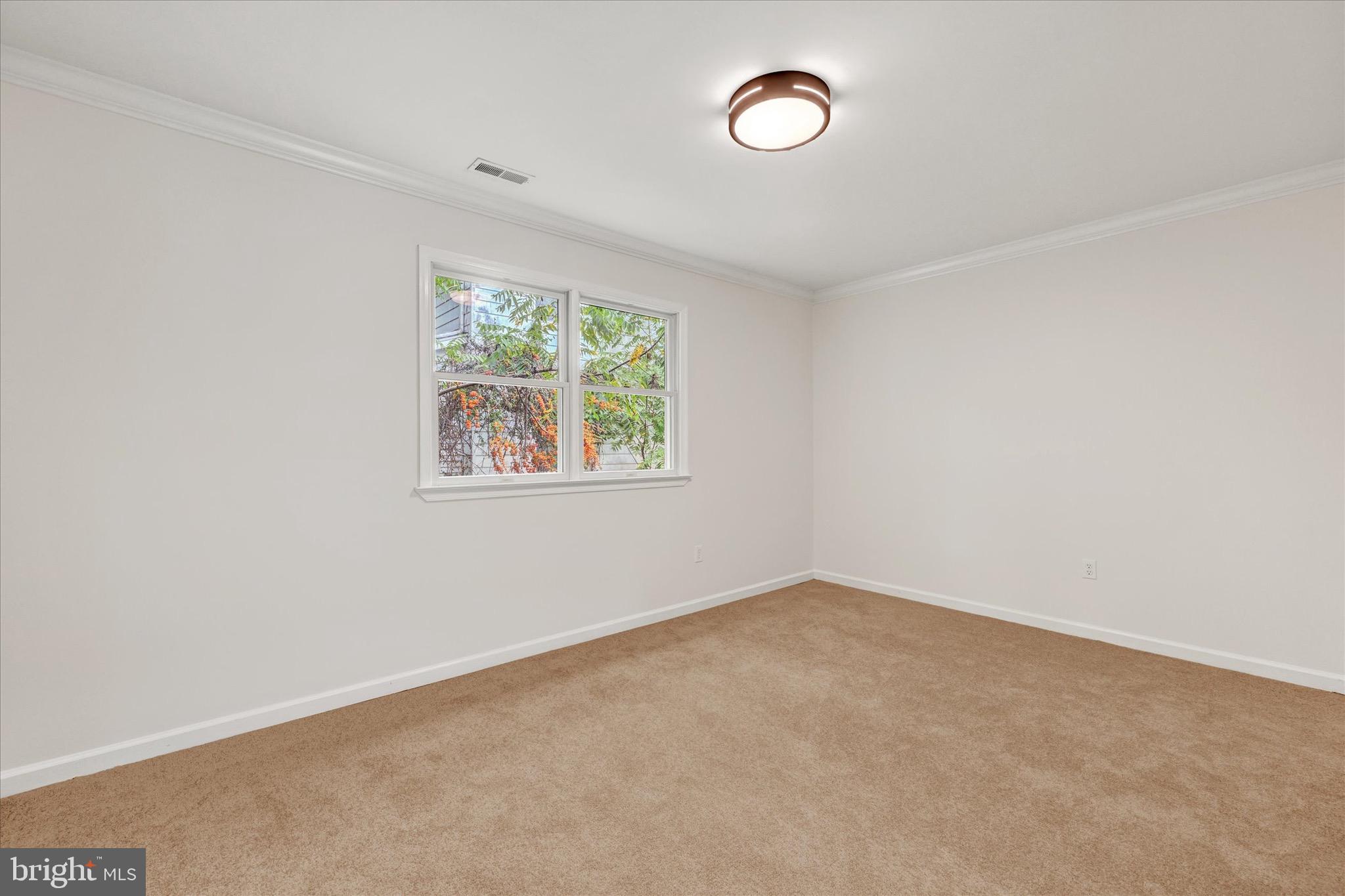 2108 Sunbriar Road Baltimore, MD 21207 - Photo 26 of 50 an empty room with windows