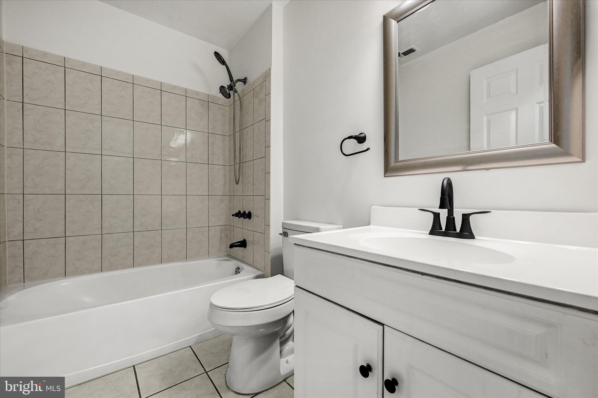 2108 Sunbriar Road Baltimore, MD 21207 - Photo 27 of 50 a bathroom with a sink a toilet and shower