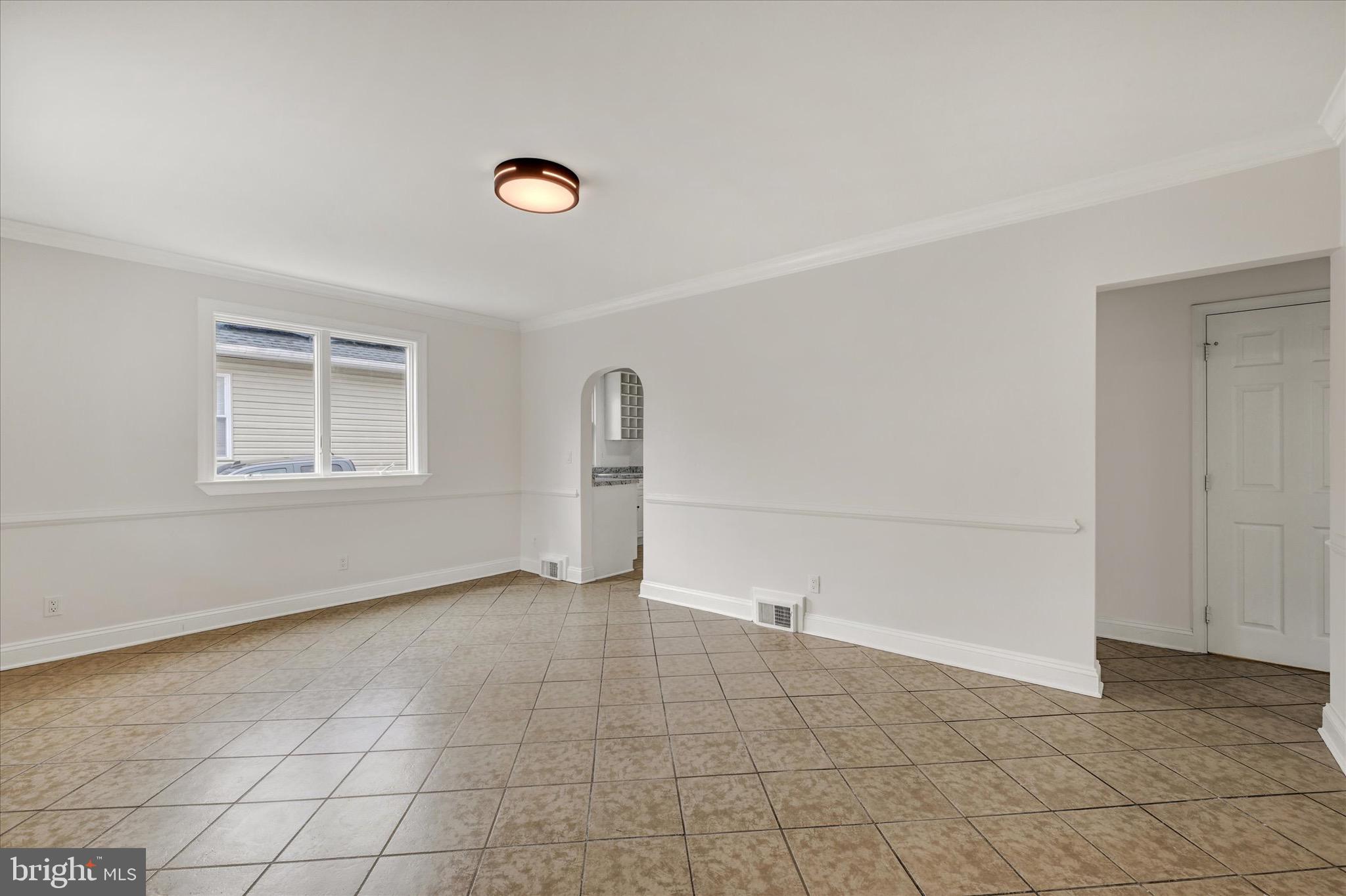 2108 Sunbriar Road Baltimore, MD 21207 - Photo 31 of 50 an empty room with windows