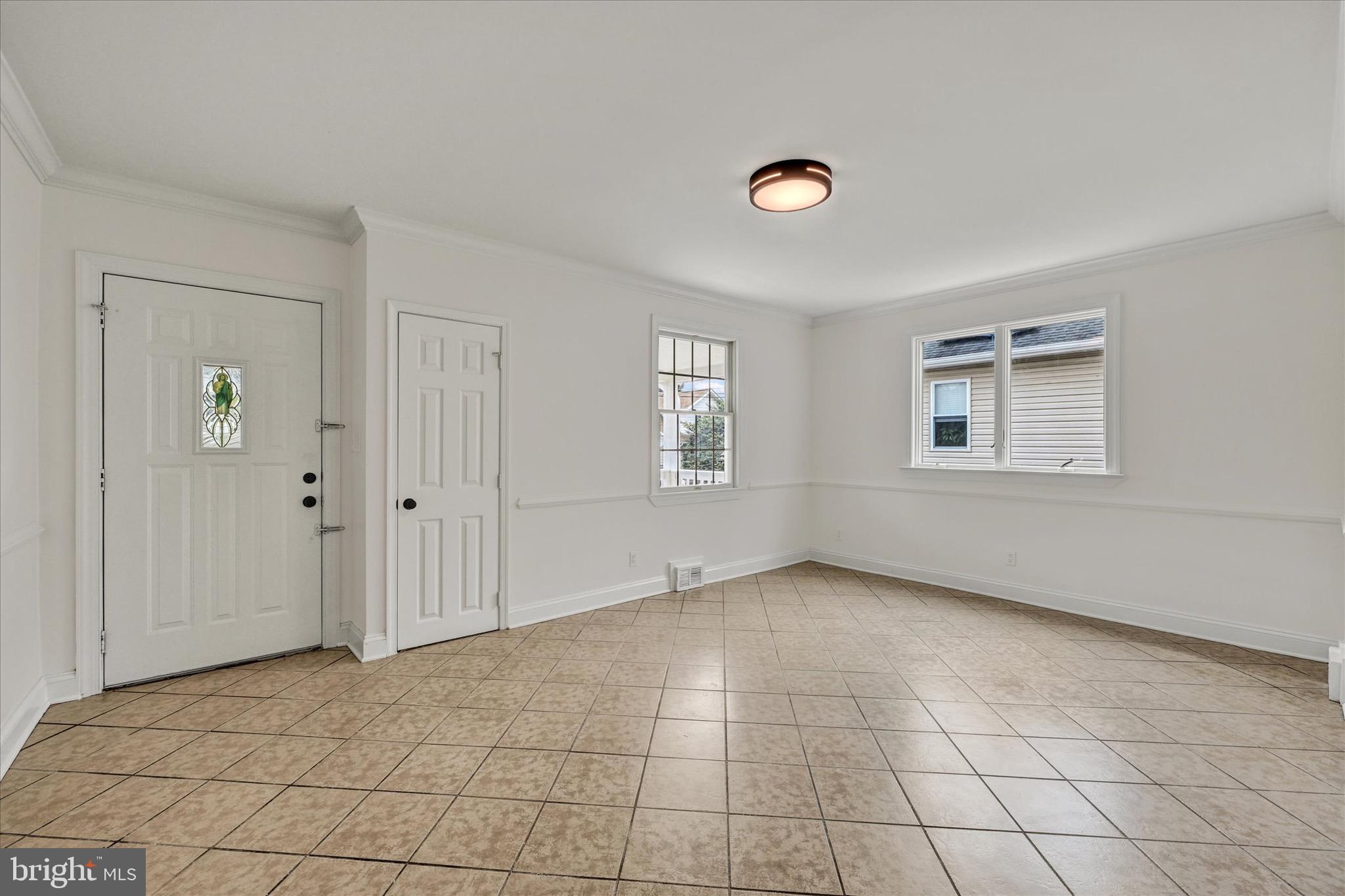 2108 Sunbriar Road Baltimore, MD 21207 - Photo 32 of 50 a view of an empty room with windows
