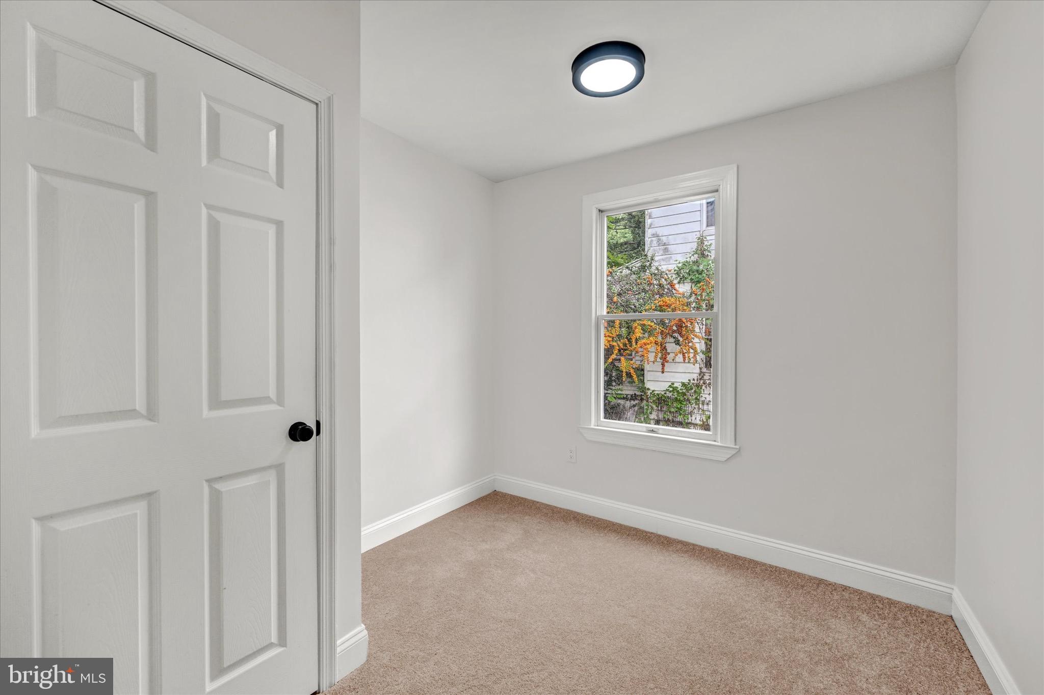 2108 Sunbriar Road Baltimore, MD 21207 - Photo 34 of 50 an empty room with windows