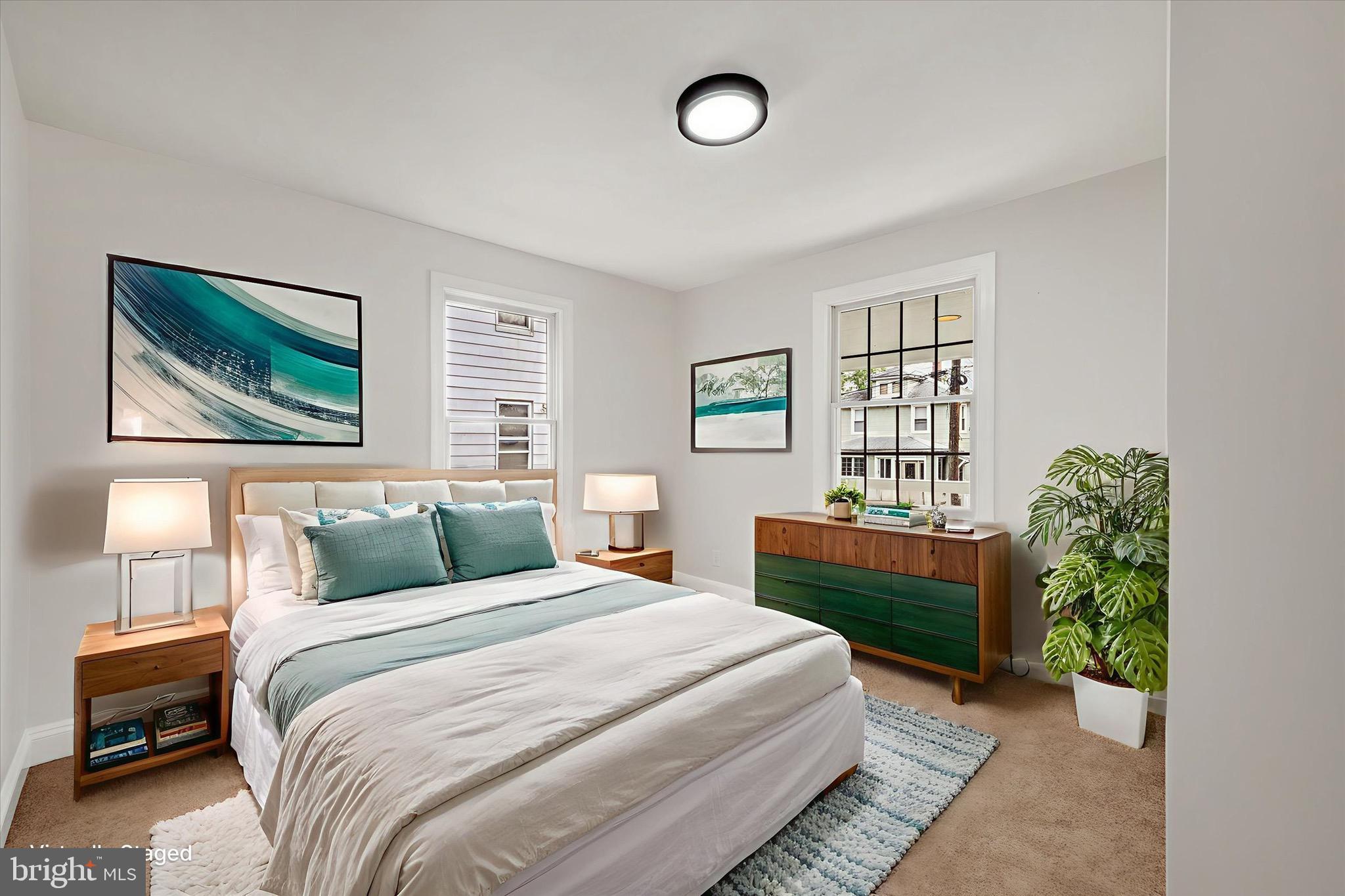 2108 Sunbriar Road Baltimore, MD 21207 - Photo 35 of 50 a bedroom with a large bed and a window