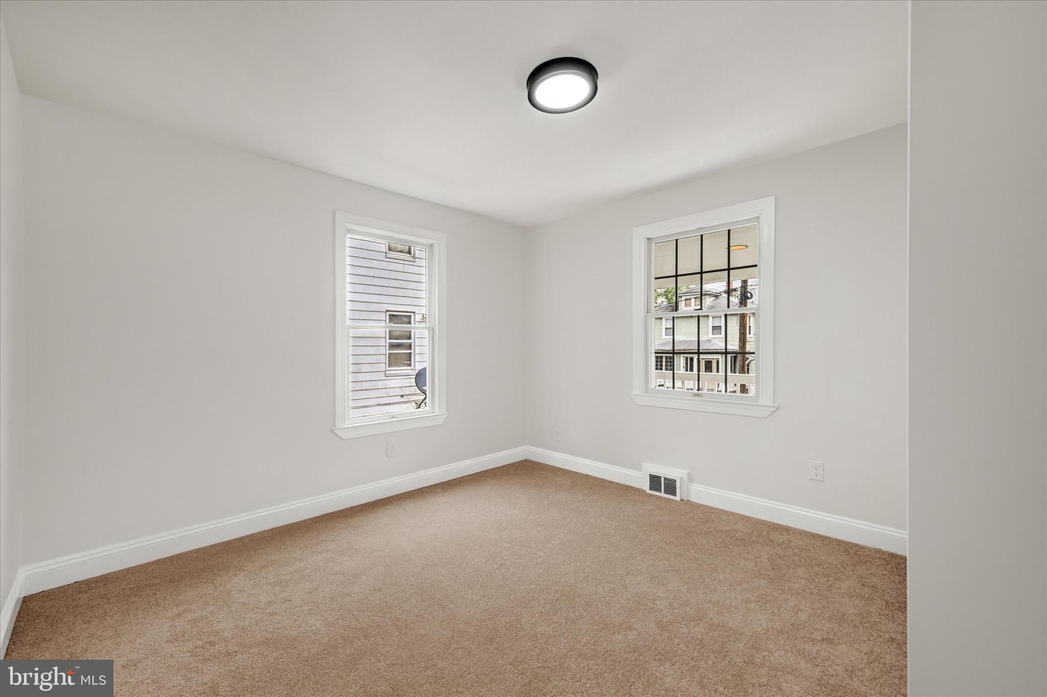 2108 Sunbriar Road Baltimore, MD 21207 - Photo 36 of 50 an empty room with windows