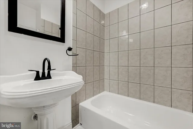 a kitchen with granite countertop a sink and a stove