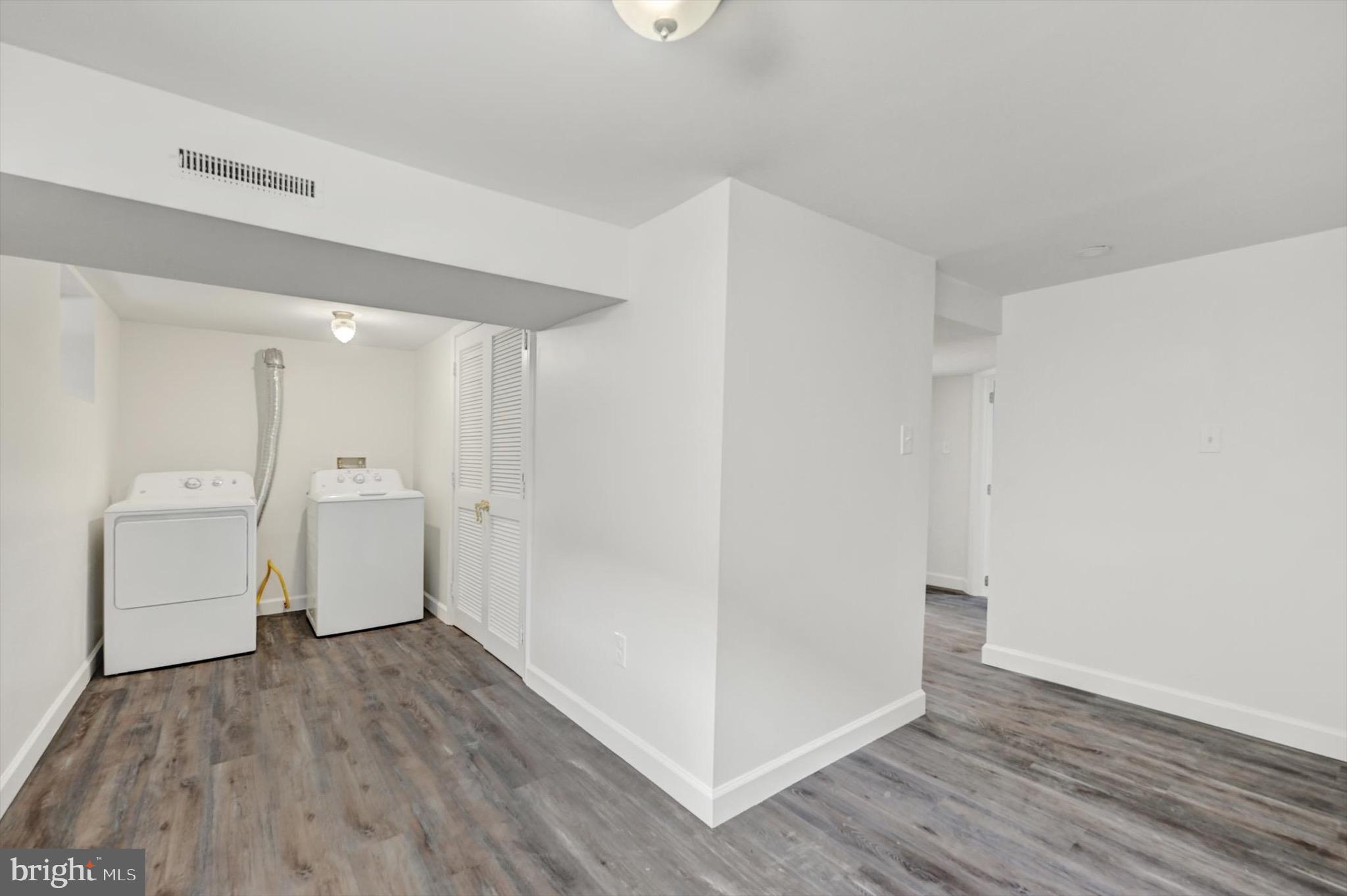 2108 Sunbriar Road Baltimore, MD 21207 - Photo 42 of 50 a view of a storage & utility room with closet and wooden floor