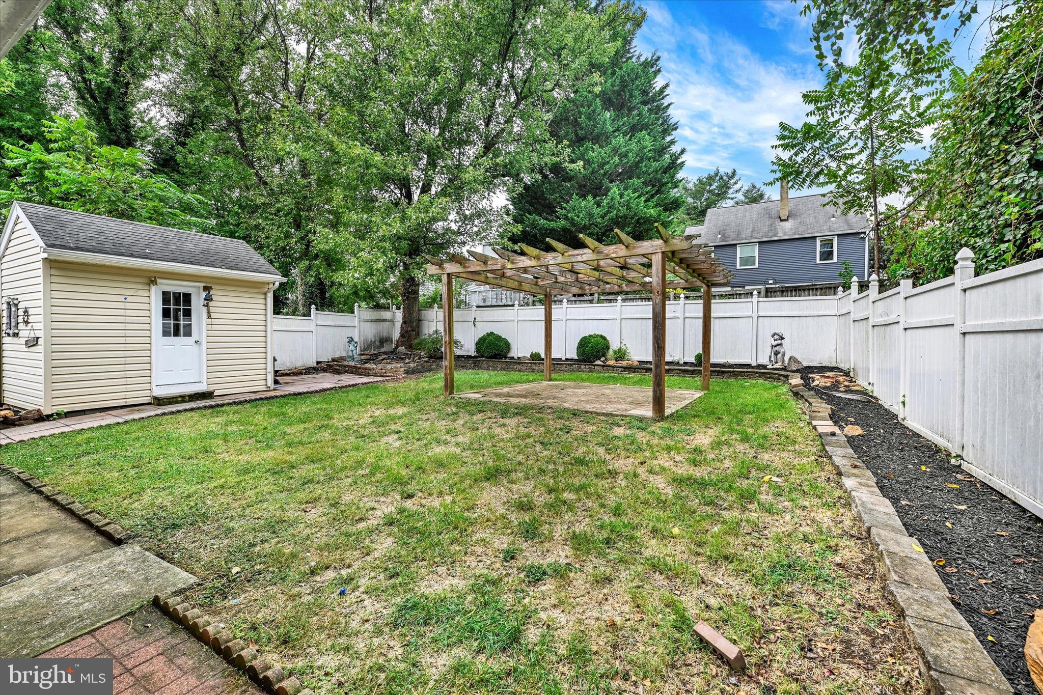 2108 Sunbriar Road Baltimore, MD 21207 - Photo 44 of 50 a view of a house with backyard and a tree