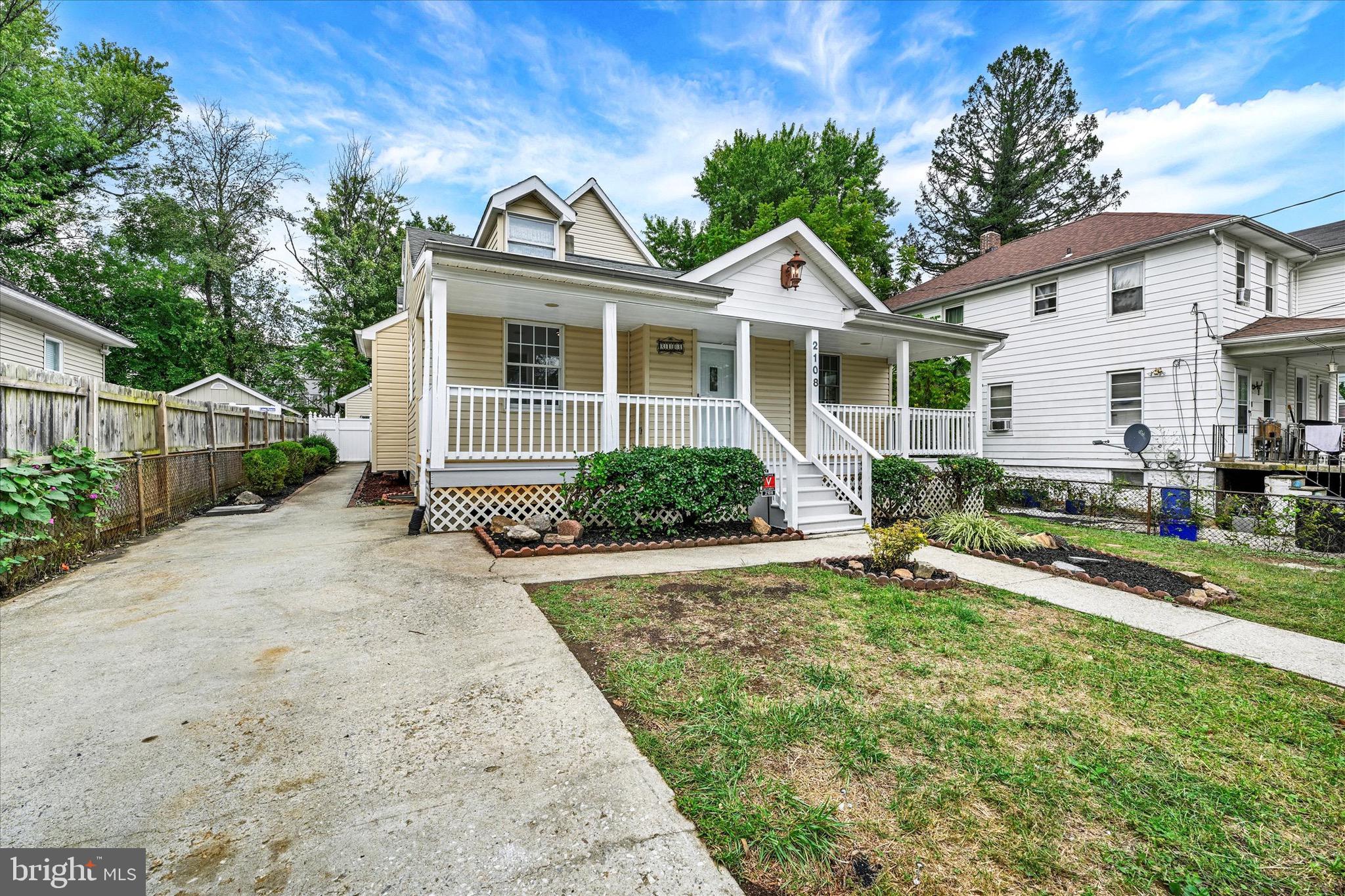 2108 Sunbriar Road Baltimore, MD 21207 - Photo 46 of 50 a front view of a house with a yard