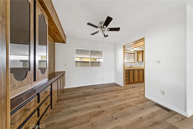 a view of an entryway with wooden floor